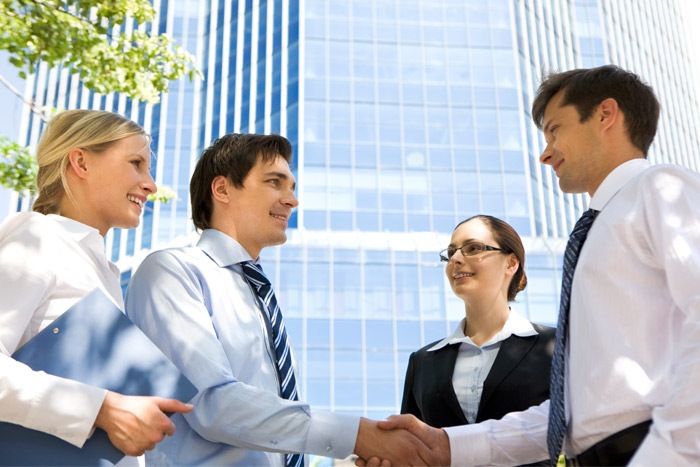 Business partners shaking hands